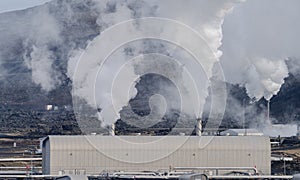 Geothermic plant with with smoke in Iceland photo