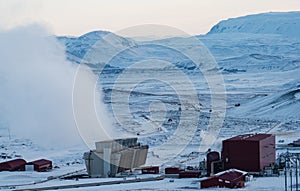 Geothermic plant with with smoke and snow in Iceland