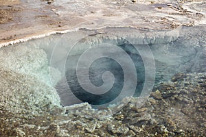 Geothermic pools with hot steam in Strokkur area, Iceland