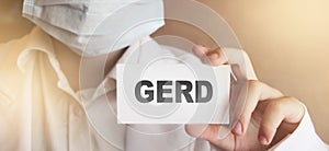 GERD card in hands of Medical Doctor. Gastro healthcare  concept