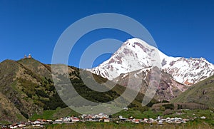 Gergeti Trinity Church and Mount Kazbek. Georgia. photo