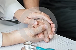 Geriatric doctor geriatrician consulting and diagnostic examining elderly senior adult patient older person on aging photo