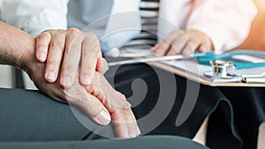 Geriatric doctor geriatrician consulting and diagnostic examining elderly senior adult patient older person on aging photo