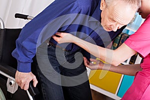 Geriatric patient sitting on wheelchair