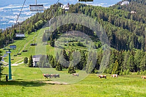 Gerlitzen - Ski lift in summer with scenic view of majestic mountain range Julian Alps seen from Gerlitzen, Carinthia