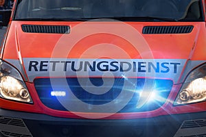 German ambulance car with flashing warning lights