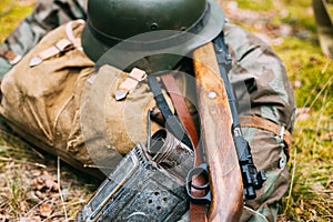 German Ammunition Of World War II On Ground. Military Helmet, Li