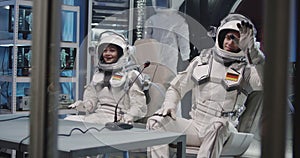 German astronauts waving during press conference