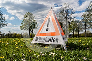 German Attention mowing warning sign