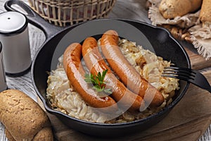 German or Austrian dinner. Wurstel sausage or frankfurter and fried crauti