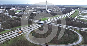 German autobahn, public highway. Traffic mobility over road. Large intersection. Birds eye aerial drone view.