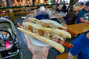 german bavarian hot dog in viktualienmarkt munich with sauerkraut street food photo