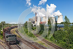 German Coal-fired power plant with empty cargo train near Garzweiler mine