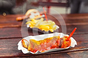 curry wurst sausage with french fries, street food concept