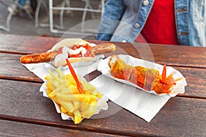 curry wurst sausage with french fries, street food concept