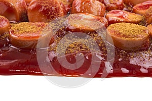 German currywurst with ketchup and curry powder