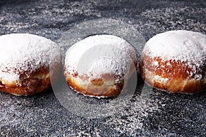 German donuts with jam and icing sugar. Carnival powdered sugar