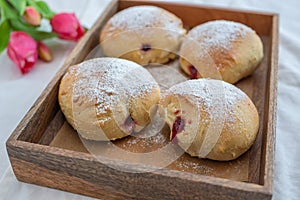 German donuts - krapfen or berliner - filled with jam