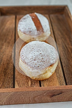 German donuts - krapfen or berliner - filled with jam