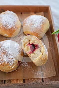 German donuts - krapfen or berliner - filled with jam