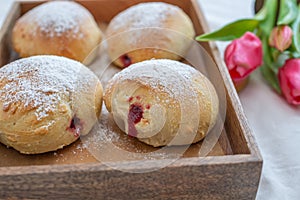 German donuts - krapfen or berliner - filled with jam