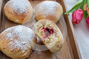 German donuts - krapfen or berliner - filled with jam