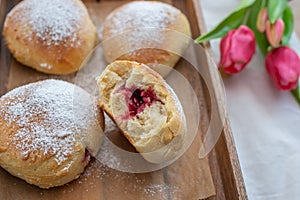 German donuts - krapfen or berliner - filled with jam