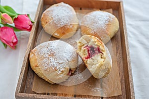 German donuts - krapfen or berliner - filled with jam