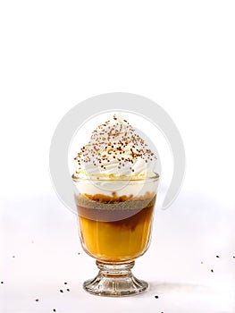 German Eierlikor in shot glass topped with whipped cream and sprinkle of nutmeg photo