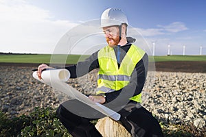 german engineer in an aerogenerator power plant with clean energy