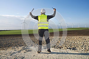 german engineer in an aerogenerator power plant with clean energy