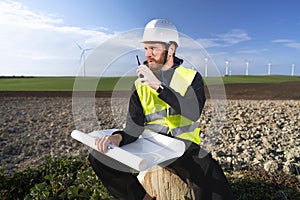 german engineer in an aerogenerator power plant with clean energy