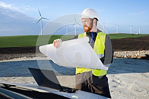 german engineer in an aerogenerator power plant with clean energy