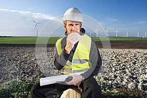 german engineer in an aerogenerator power plant with clean energy