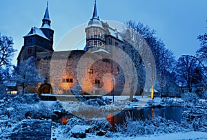 German fairytale castle in winter landscape. Castle Romrod in Hessen, Germany