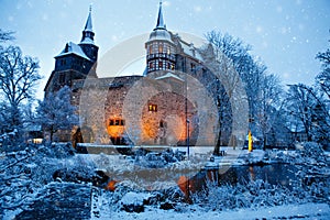 German fairytale castle in winter landscape. Castle Romrod in Hessen, Germany