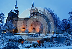 German fairytale castle in winter landscape. Castle Romrod in Hessen, Germany photo
