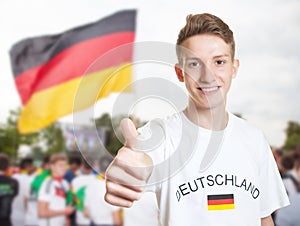 German fan showing thumb with other fans