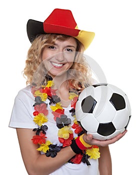 German female soccer fan with hat and ball