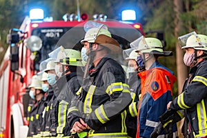 German firemen stands near a fire truck during an exercise