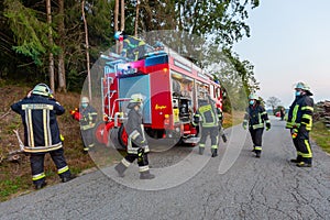 German firemen stands near a fire truck during an exercise
