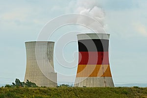 The German flag is depicted on the cooling tower of the nuclear power plant