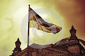 German flag flies above the Reichstag Building in Berlin