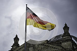 German flag flies above the Reichstag Building in Berlin