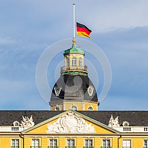 German Flag at Halfmast, auf Halbmast, on the top of Castle Karlsruhe. In Karlsruhe, Baden-WÃ¼rttemberg, Germany