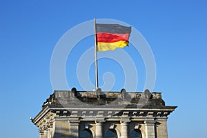 German flag waving on Bundestag in Berlin