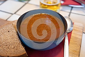 German food, thick, rich goulash meat soup served hot in bowl in old German cafe in countryside