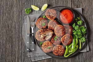 german frikadellen of ground meat on a plate photo