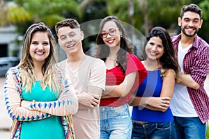 German girl with male and female young adults in line