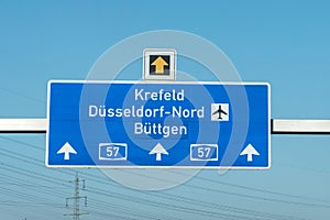 German highway autobahn blue road sign leading to airport duesseldorf